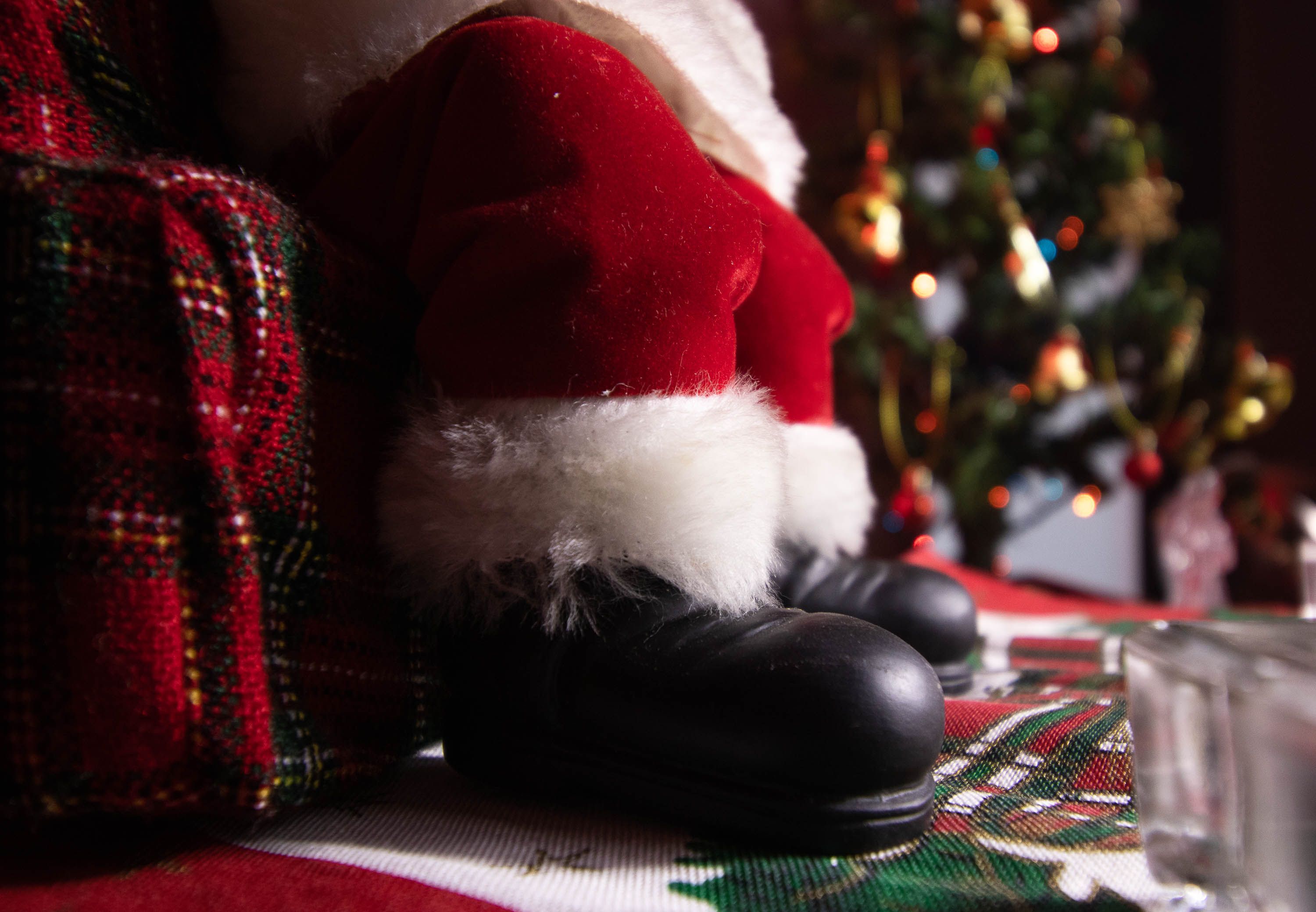 Santa Claus in a warm candlelit holiday setting